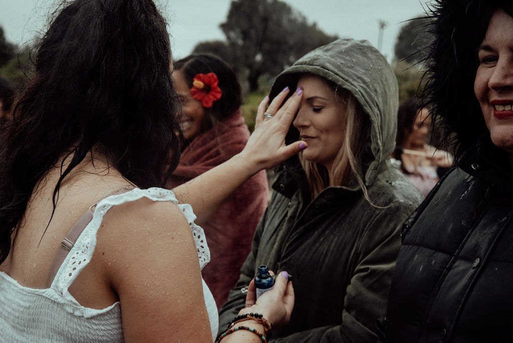 Janelle facilitating a ritual moment at the beach