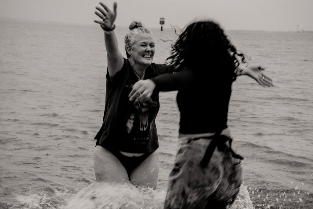 Women playing and laughing in the water
