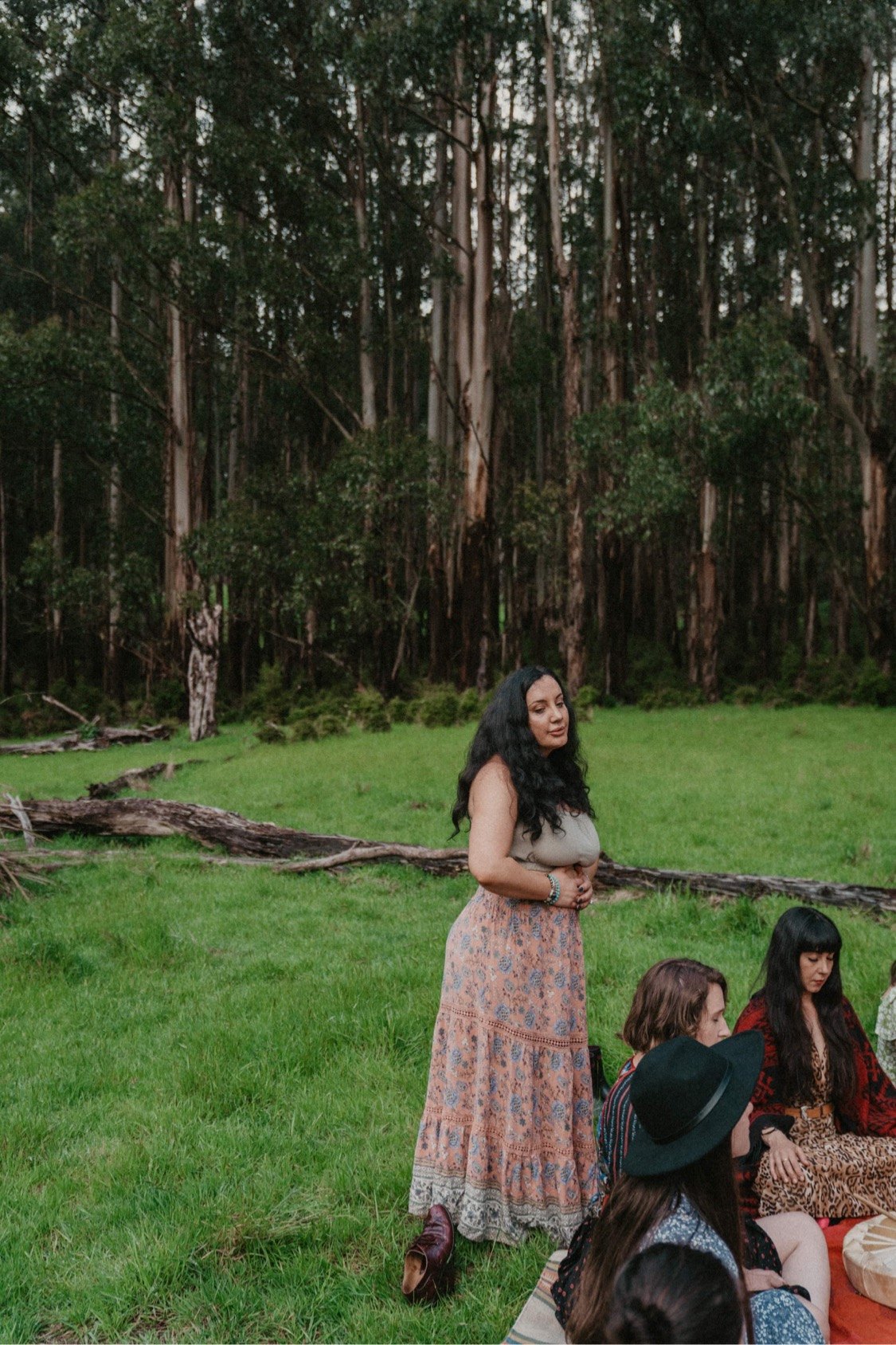 Janelle holding a women's circle in the forest